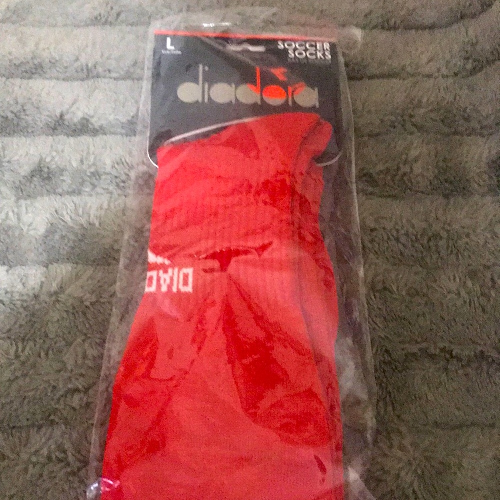 Red Diadora soccer sock size large (10-13)